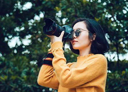 Woman Taking Picture With Camera